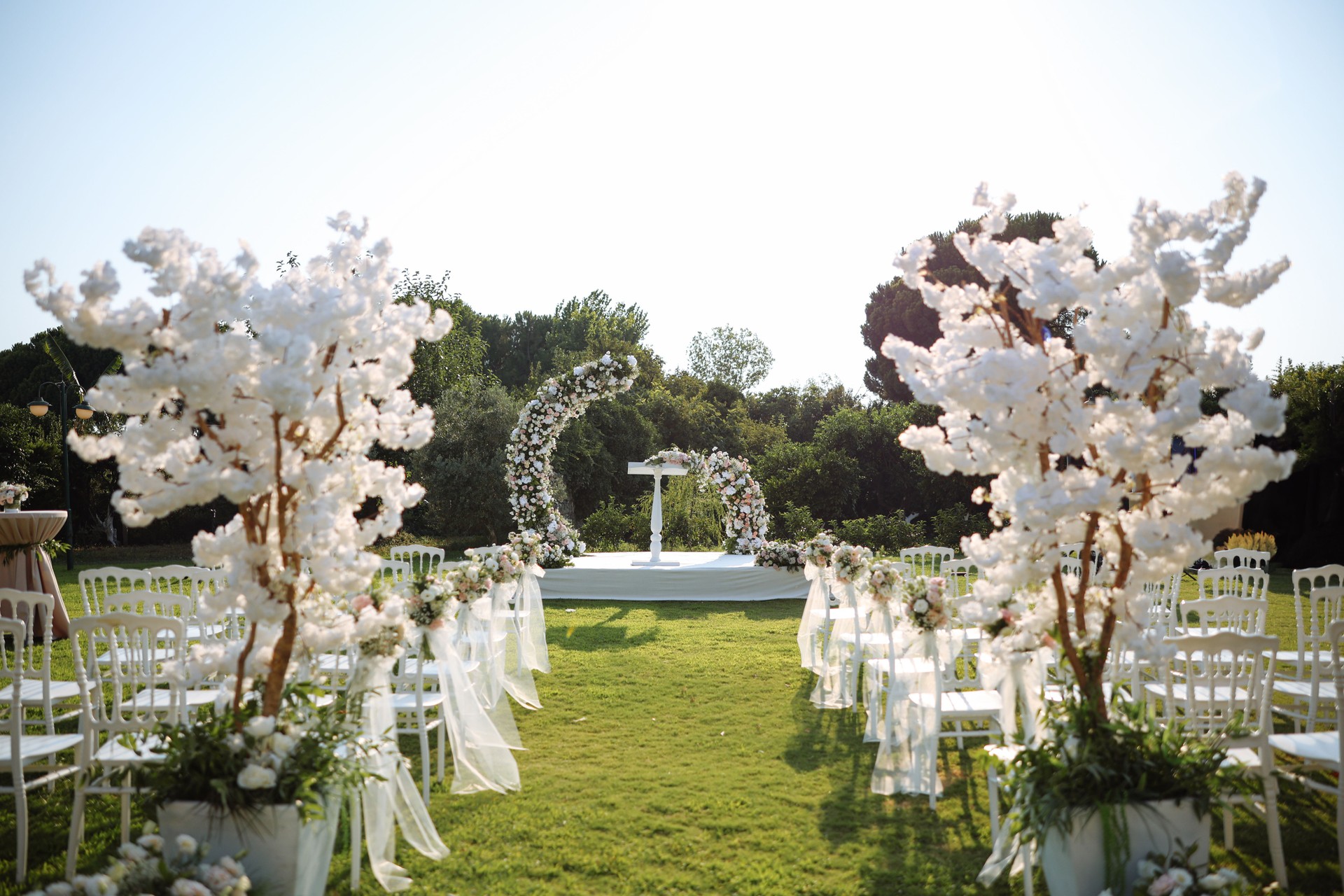 Outside place decorated with flowers for the wedding ceremony.